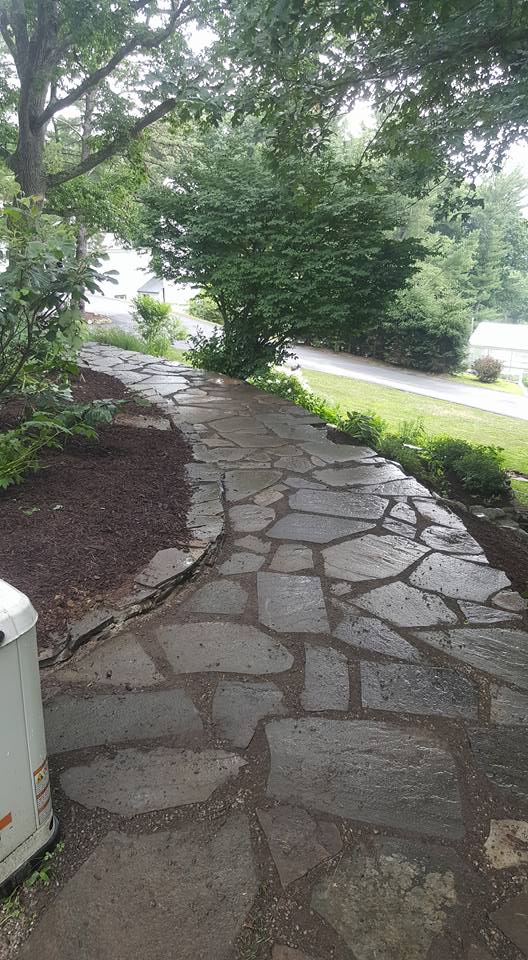 Natural flagstone walkway with landscaping