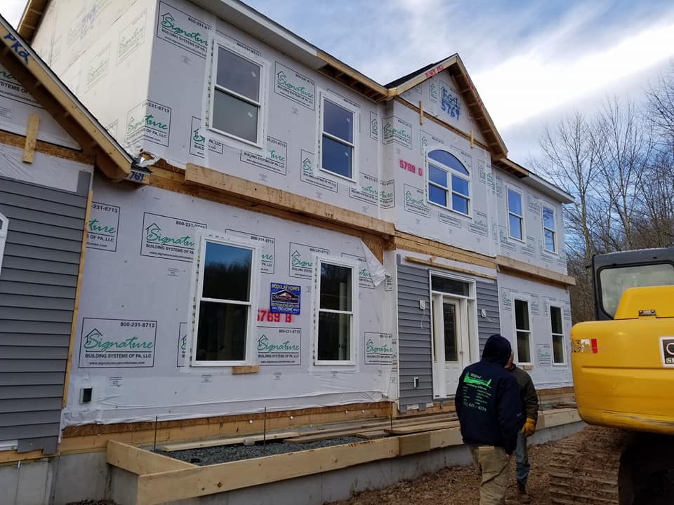 Construction site with professional general contractor overseeing renovation project