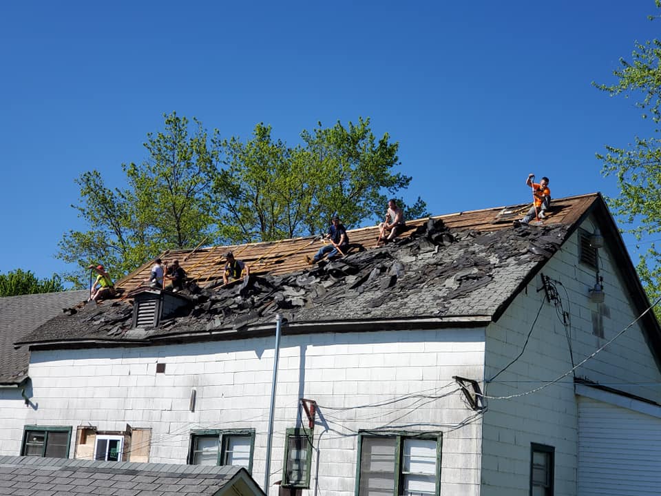 Roof tear-off and replacement crew at work